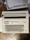Smith Corona 250DLE 5A Electric Portable Typewriter Complete W/ Cover Works. Fixed Price $65.00.