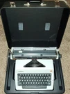 Vintage 1977 Olympia SM9-13 Portable Typewriter & Case Germany. Fixed Price $300.00.