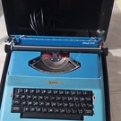 Royal Apollo 12-GT Blue Electric Portable Typewriter With Case & Power Cable. Fixed Price $25.00.