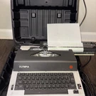 Vintage Olympia International Typewriter Model CE-R12 With Case For Repair. Fixed Price $35.00.