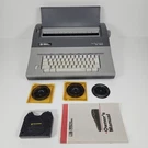 Smith Corona A5-1 SL560 Portable Electronic Typewriter Spell Right W/ 3 Wheels. Fixed Price $79.95.