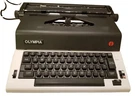 Olympia Electric Typewriter Model CE-R12 With Case, Clean Good Working Order. Fixed Price $110.00.
