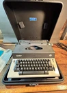 Vintage Olympia Report De Luxe Electric Typewriter W/case. Fixed Price $120.00.