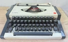 Olympia Traveller De Luxe Typewriter& Case , Works But Needs Full Service. Fixed Price $119.56.