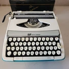 Smith Corona Cougar Deluxe Portable Manual Typewriter W/ Case Turquoise Script !. Fixed Price $325.00.